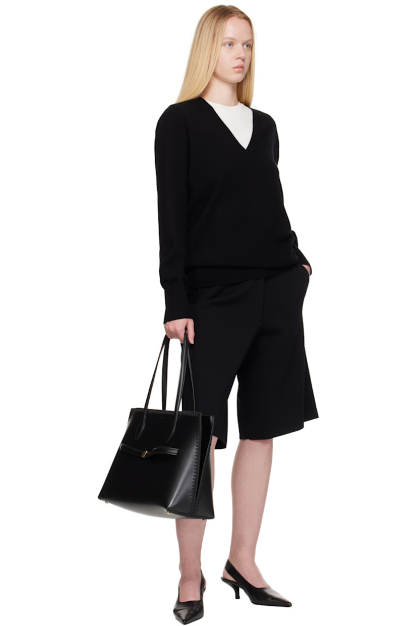 Buffed leather tote.

· Embroidered detailing throughout
· Fixed shoulder straps
· Logo stamped at face
· Removable strap at face
· Lobster clasp closure
· Patch pocket at interior
· Microsuede lining
· Gold-tone hardware
· H11” x W17” x D10”

Supplier color: Black