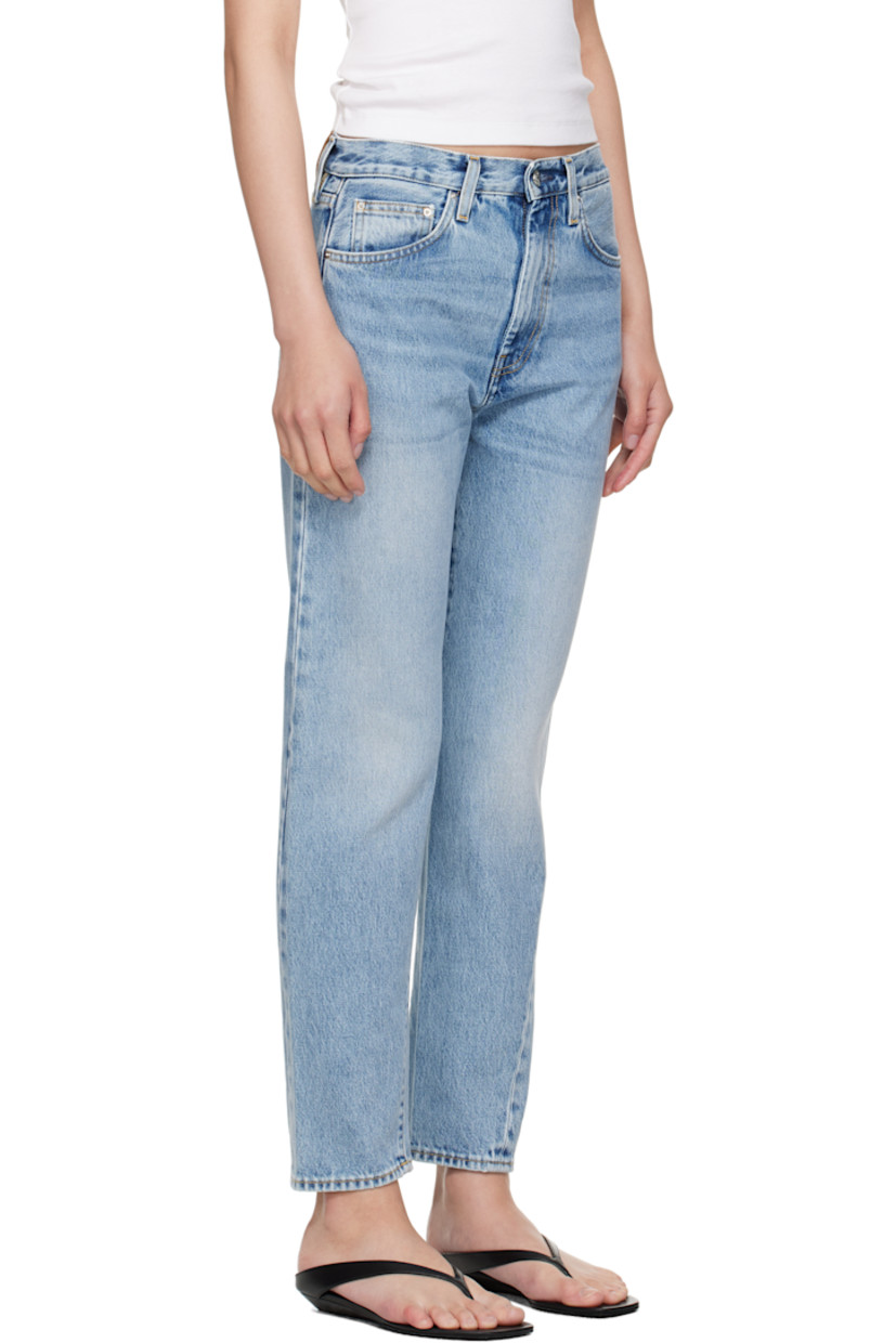 Non-stretch organic cotton denim jeans. Fading and whiskering throughout.

· Straight-leg
· Mid-rise
· Belt loops
· Five-pocket styling
· Zip fly
· Twisted outseams
· Leather logo patch at back waistband
· Silver-tone hardware
· Contrast stitching in tan

Supplier color: Worn blue