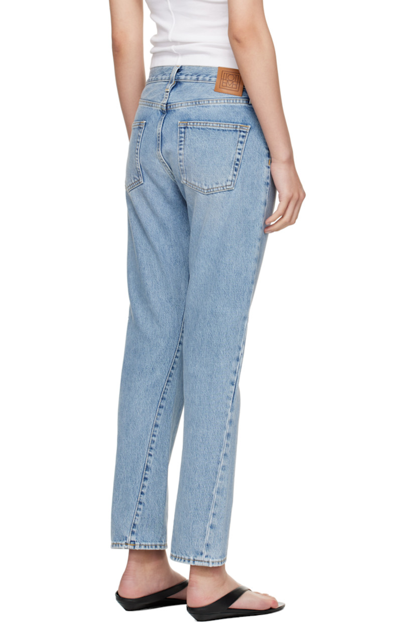 Non-stretch organic cotton denim jeans. Fading and whiskering throughout.

· Straight-leg
· Mid-rise
· Belt loops
· Five-pocket styling
· Zip fly
· Twisted outseams
· Leather logo patch at back waistband
· Silver-tone hardware
· Contrast stitching in tan

Supplier color: Worn blue
