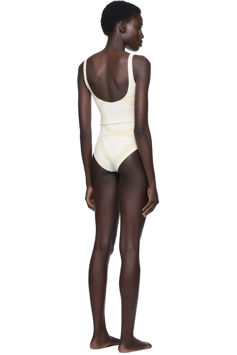 Stretch nylon jersey one-piece swimsuit. Logo printed throughout.

· Scoop neck
· Low back
· Fully lined

Supplier color: Sand