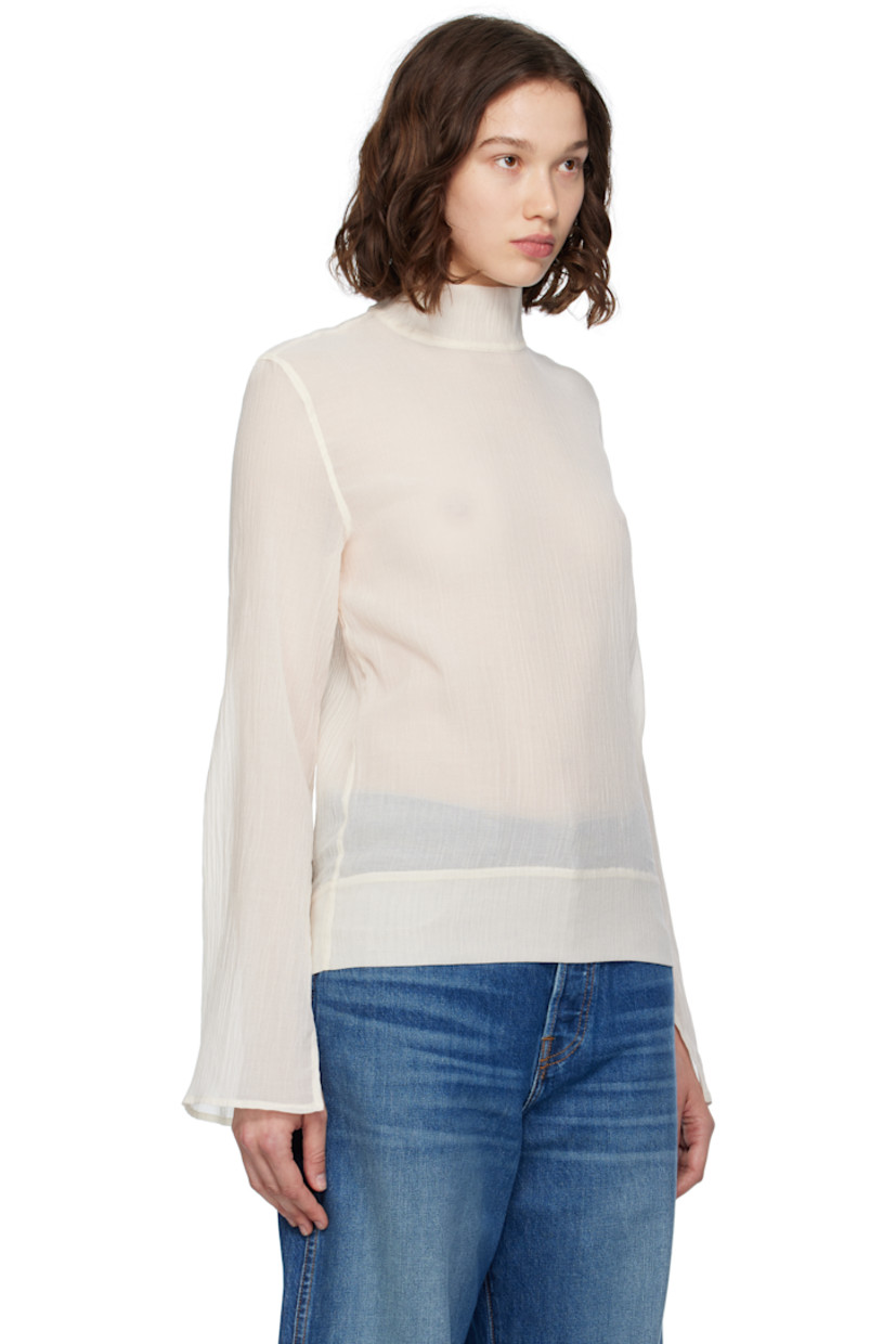 Semi-sheer cotton- and silk-blend gauze blouse.

· Mock neck
· Slit at cuffs
· Concealed zip closure at back

Supplier color: Ecru