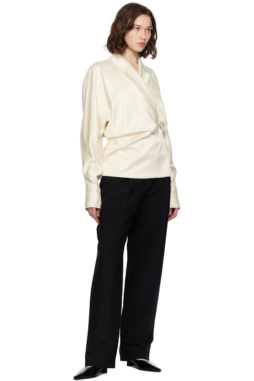 Viscose satin blouse. 
 
· Wrap construction
· Notched lapel
· Topstitched stripes at front
· Single-button closure
· Dolman sleeves
· Buttoned barrel cuffs

Supplier color: Ecru