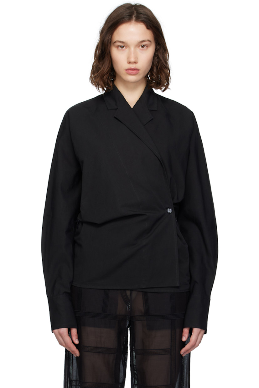 Organic cotton- and linen-blend broadcloth blouse. 
 
· Notched lapel
· Offset button closure
· Topstitched detailing at front
· Dolman sleeves
· Buttoned barrel cuffs

Supplier color: Black