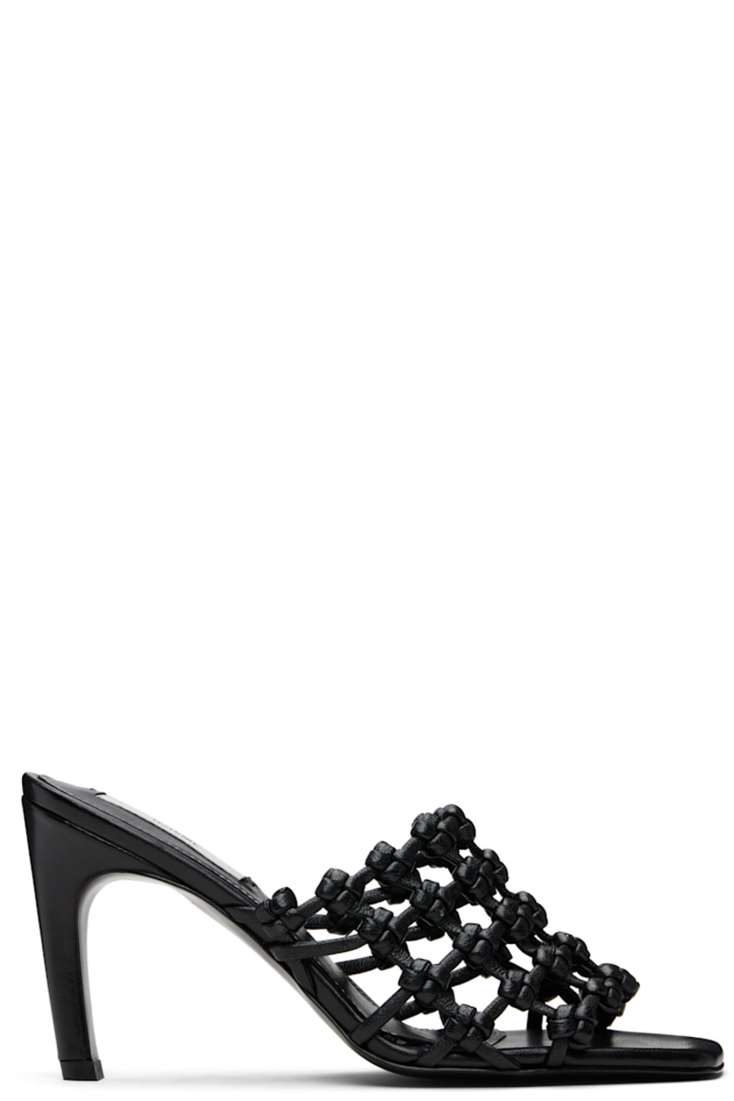 LWG-certified grained goatskin mules. 

· Open square toe 
· Braided strap at vamp
· Logo patch at padded sheepskin footbed
· Covered stiletto heel with rubber injection 
· Leather sole with rubber injection 
· Heel: H3.5"

Supplier color: Black