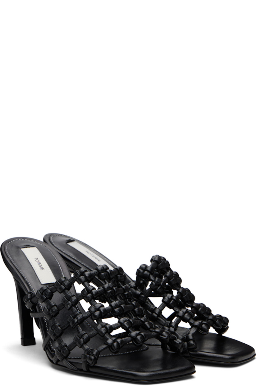 LWG-certified grained goatskin mules. 

· Open square toe 
· Braided strap at vamp
· Logo patch at padded sheepskin footbed
· Covered stiletto heel with rubber injection 
· Leather sole with rubber injection 
· Heel: H3.5"

Supplier color: Black