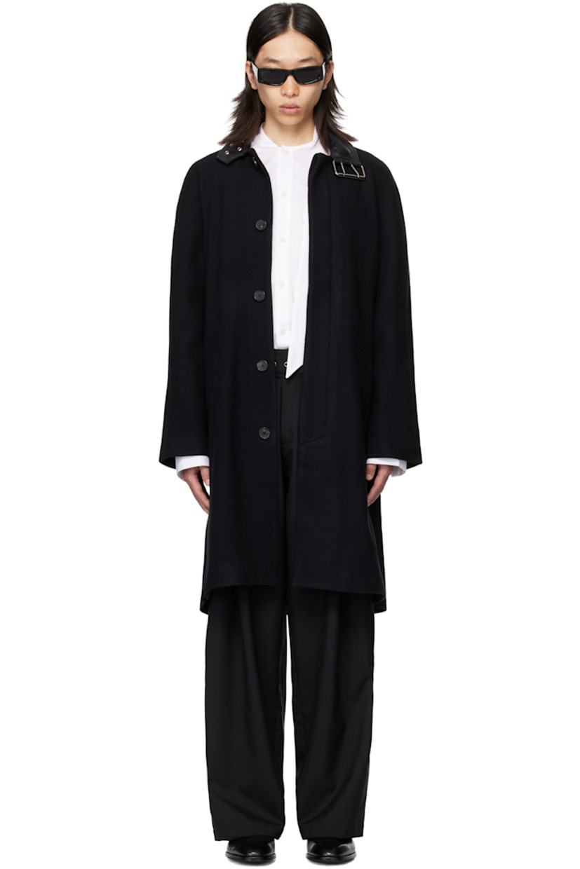 Brushed wool broken twill coat.

· Pin-buckle fastening at buffed sheepskin spread collar
· Concealed button closure
· Welt pockets at waist
· Raglan sleeves
· Central vent at back hem
· Full satin lining

Supplier color: Black