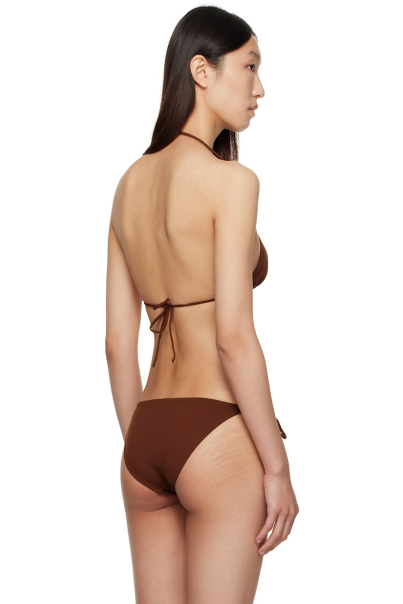 Stretch nylon jersey bikini top.

· Gold-tone hardware at chest
· Self-tie halter and fastening at back
· Press-stud travel pouch included

Supplier color: Tortue