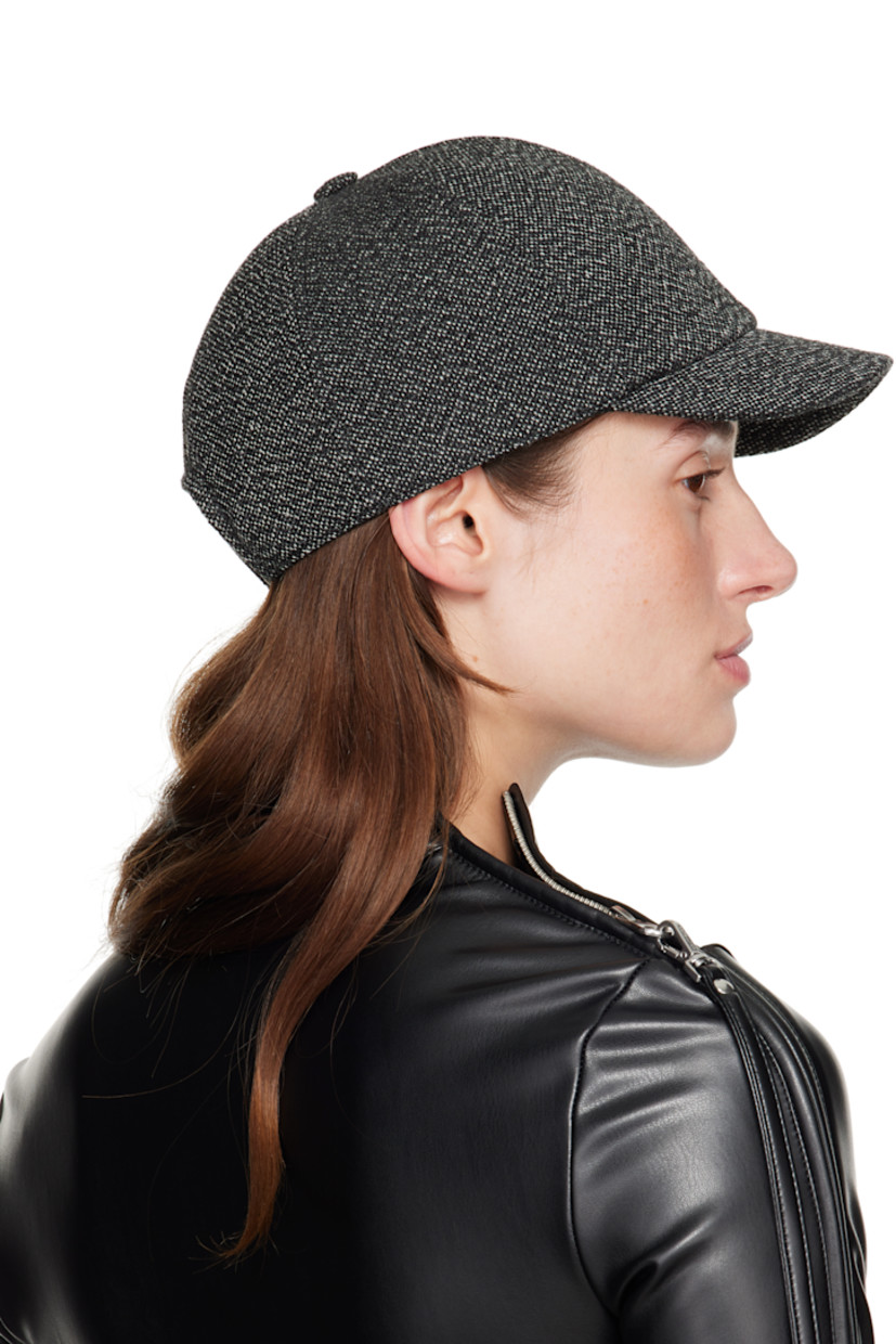 Knit wool cap. 

· Curved brim
· Embroidered logo patch at side 
· Snapback fastening at back
· Plain-woven browband 

Supplier color: Black/Heritage white