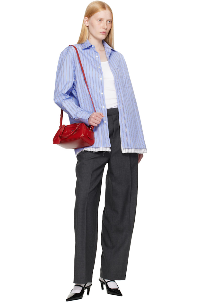 Cotton poplin shirt-style minidress. Stripes throughout

· Spread collar
· Button closure
· Logo flag and patch pocket at chest
· Logo embroidered at front
· Raw edge at tiered hem
· Adjustable buttoned barrel cuffs
· Box pleat at back yoke
· Logo-engraved mother-of-pearl hardware

Supplier color: Japanese blue stripe