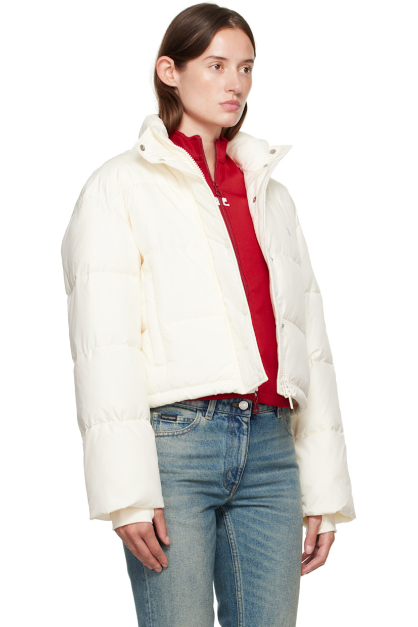 Insulated and quilted satin jacket.

· Stand collar
· Two-way zip closure with press-stud placket
· Zip pockets at front
· Bungee-style drawstring at cropped hem
· Logo flag at side seam
· Thumbhole at inset jersey cuffs
· Zip pocket at interior
· Fully lined

Supplier color: Natural