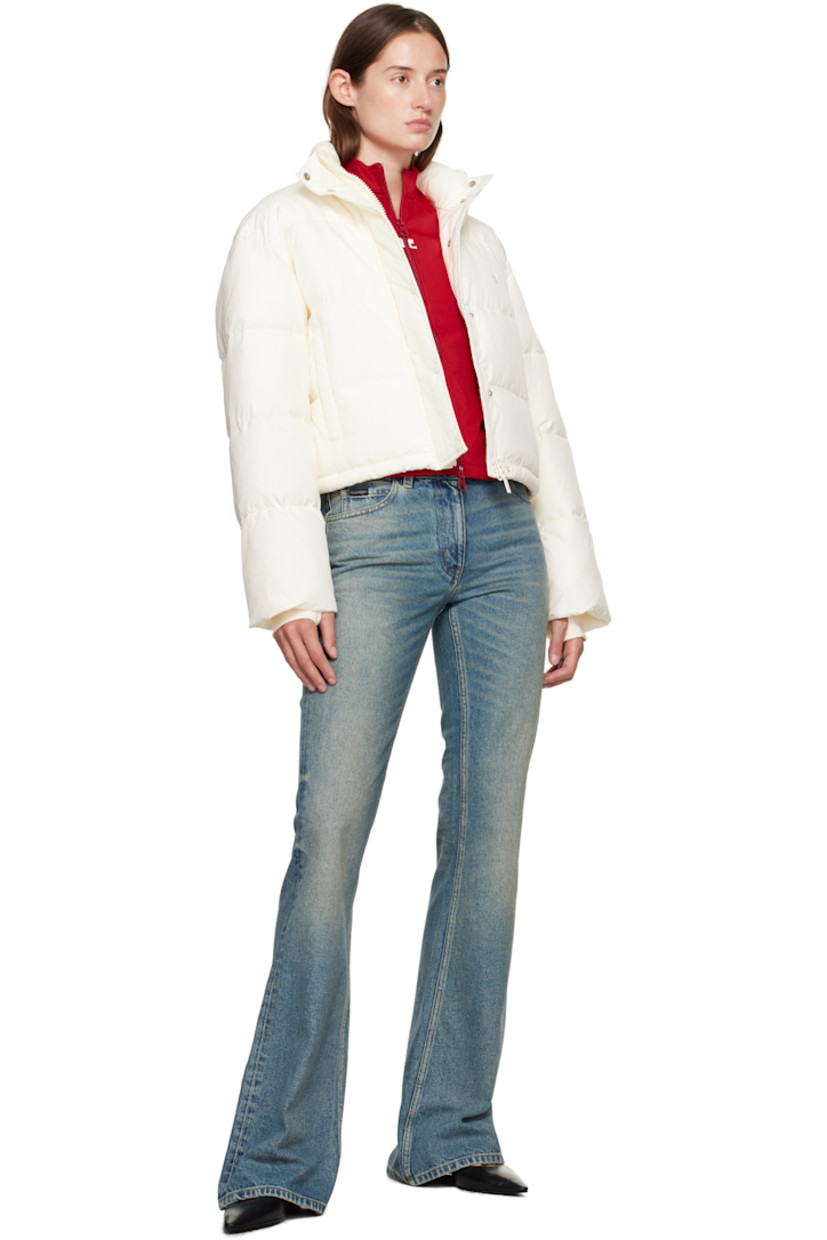 Insulated and quilted satin jacket.

· Stand collar
· Two-way zip closure with press-stud placket
· Zip pockets at front
· Bungee-style drawstring at cropped hem
· Logo flag at side seam
· Thumbhole at inset jersey cuffs
· Zip pocket at interior
· Fully lined

Supplier color: Natural