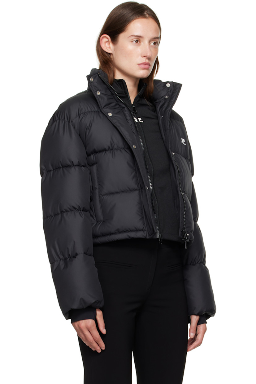 Insulated and quilted satin jacket.

· Stand collar
· Two-way zip closure with press-stud placket
· Zip pockets at front
· Bungee-style drawstring at cropped hem
· Logo flag at side seam
· Thumbhole at inset jersey cuffs
· Zip pocket at interior
· Fully lined

Supplier color: Black