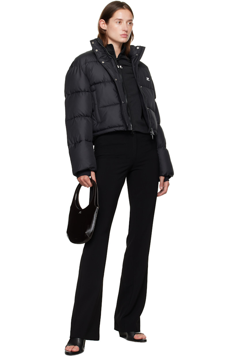 Insulated and quilted satin jacket.

· Stand collar
· Two-way zip closure with press-stud placket
· Zip pockets at front
· Bungee-style drawstring at cropped hem
· Logo flag at side seam
· Thumbhole at inset jersey cuffs
· Zip pocket at interior
· Fully lined

Supplier color: Black