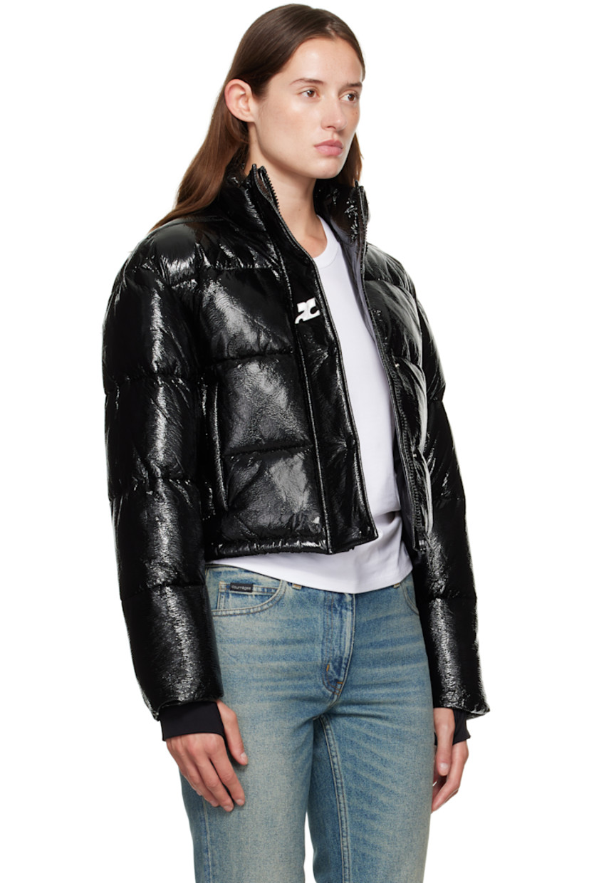 Insulated and quilted stretch vinyl jacket.

· Stand collar
· Two-way zip closure with press-stud placket
· Zip pockets at front
· Bungee-style drawstring at cropped hem
· Logo flag at side seam
· Thumbhole at inset jersey cuffs
· Logo-engraved D-ring at back collar
· Zip pocket at interior
· Full satin lining

Supplier color: Black