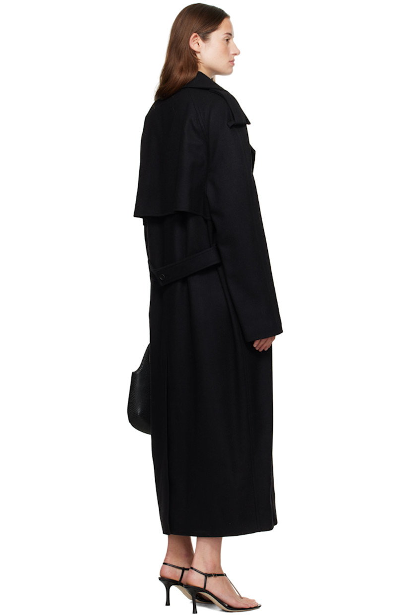 Wool-blend melton trench coat.

· Modified notched lapel
· Double-breasted button closure
· Welt pockets at waist
· Integrated button belt
· Epaulets
· Raglan sleeves
· Zip vent and button tab at cuffs
· Storm flap at back
· Central vent at back hem
· Welt pocket at interior
· Full satin lining

Supplier color: Black