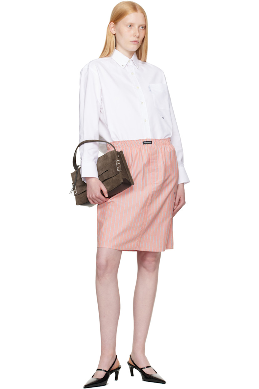 Cotton oxford cloth midi skirt. Stripes throughout.

· Logo patch at elasticized waistband
· Button fly
· Logo embroidered at front

Supplier color: Coral stripe oxford