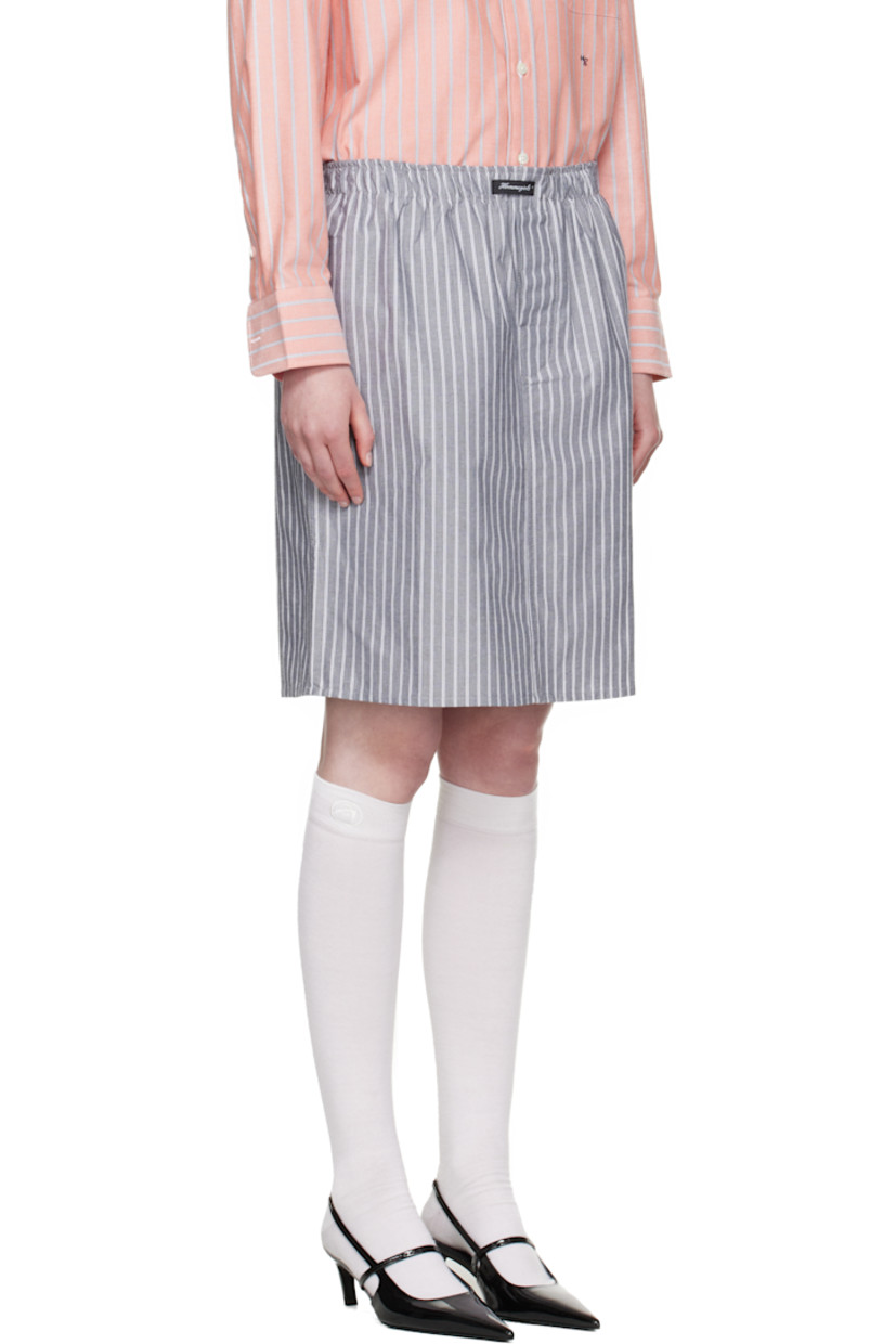 Cotton oxford cloth midi skirt. Stripes throughout.

· Logo patch at elasticized waistband
· Button fly
· Logo embroidered at front

Supplier color: Black stripe oxford