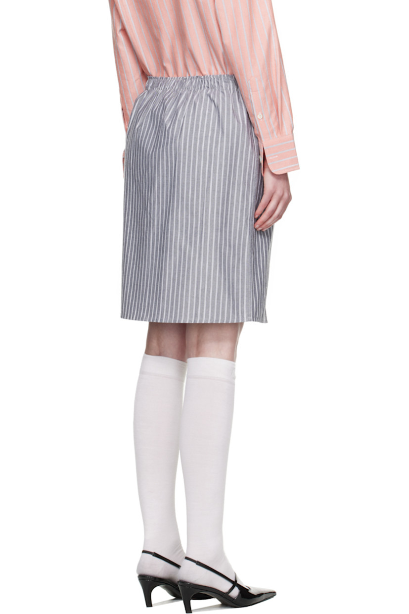 Cotton oxford cloth midi skirt. Stripes throughout.

· Logo patch at elasticized waistband
· Button fly
· Logo embroidered at front

Supplier color: Black stripe oxford
