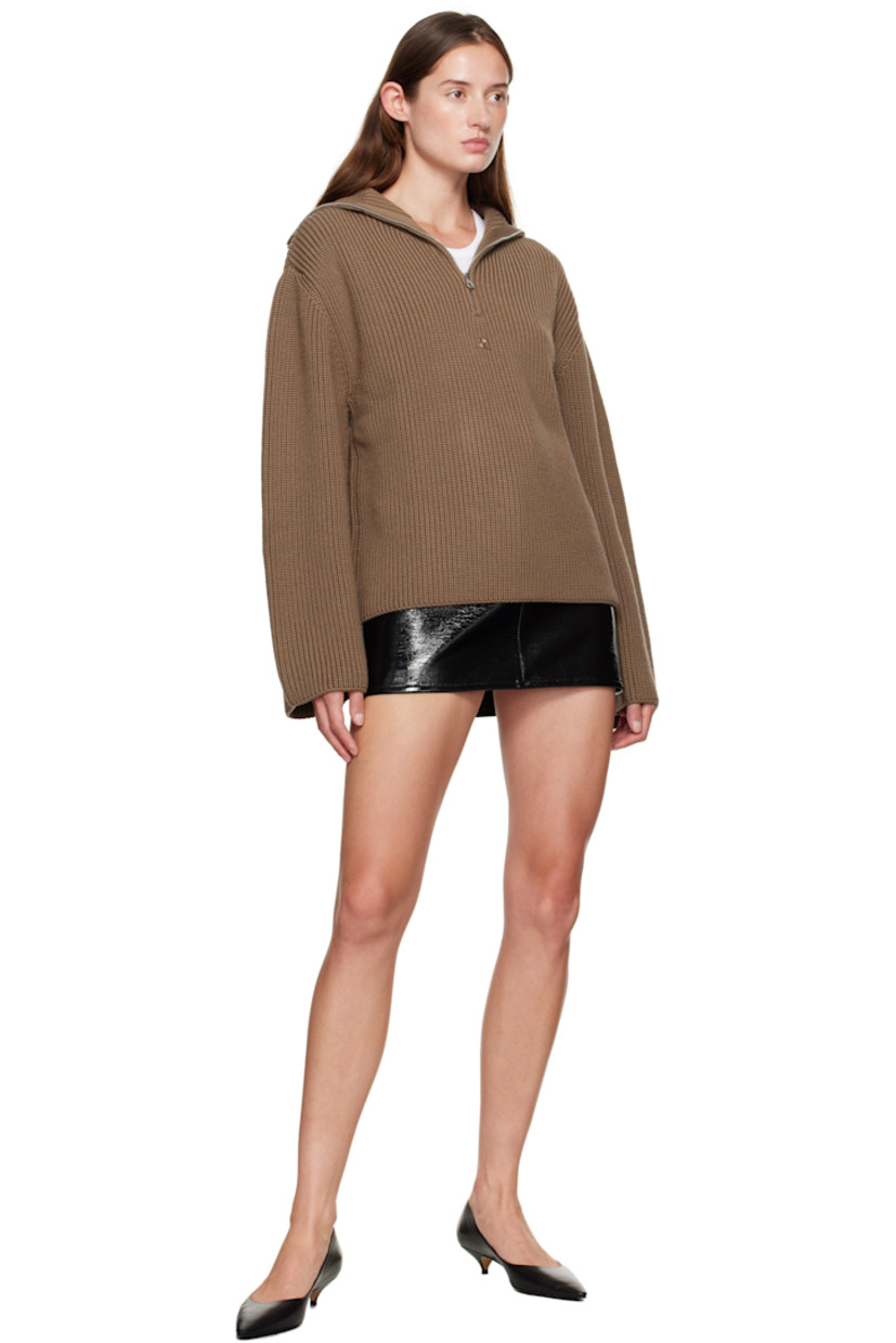 Rib-knit merino wool sweater.

· Funnel neck
· Half-zip closure
· Logo embroidered at chest
· Dropped shoulders

Supplier color: Mocha