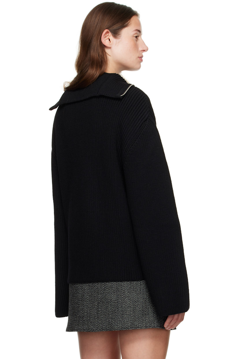 Rib-knit merino wool sweater.

· Funnel neck
· Half-zip closure
· Logo embroidered at chest
· Dropped shoulders

Supplier color: Black