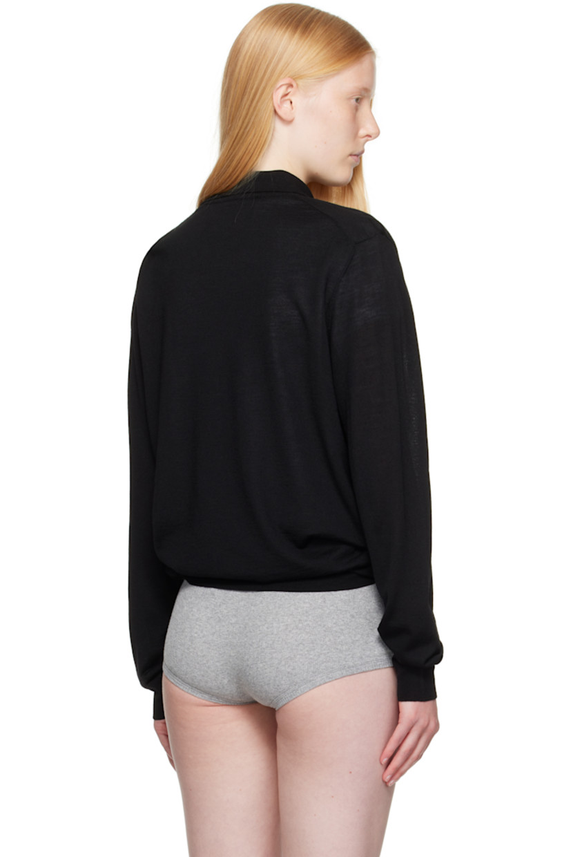 Semi-sheer knit merino wool polo. 

· Rib-knit spread collar, hem, and cuffs
· Three-button placket
· Logo embroidered at front

Supplier color: Black