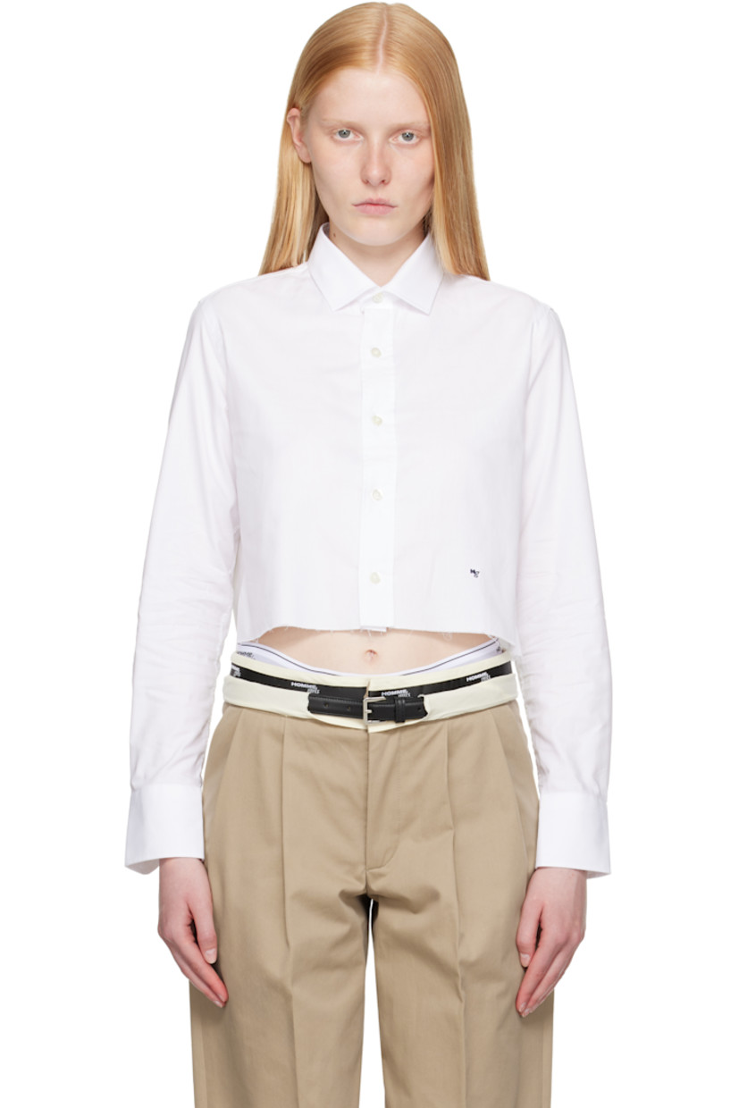 Cotton poplin shirt.

· Spread collar
· Button closure
· Logo embroidered at front
· Raw edge at cropped hem
· Adjustable buttoned barrel cuffs
· Box pleat at back yoke
· Logo-engraved mother-of-pearl hardware

Supplier color: White