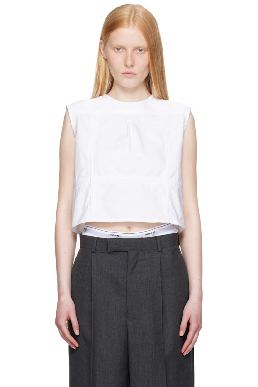 Cotton oxford cloth top.

· Paneled construction
· Round neck
· Box pleat at front yoke
· Button closure at back
· Logo embroidered

Supplier color: White oxford