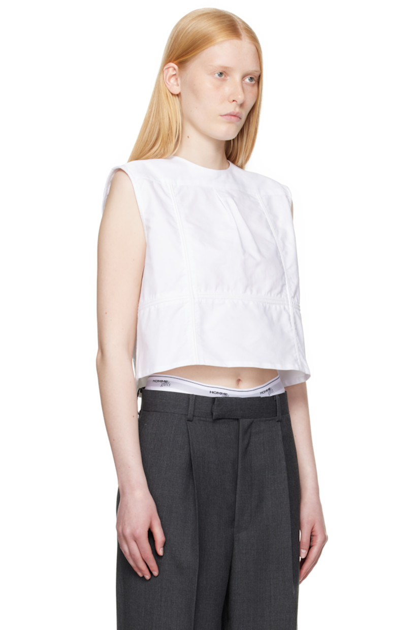 Cotton oxford cloth top.

· Paneled construction
· Round neck
· Box pleat at front yoke
· Button closure at back
· Logo embroidered

Supplier color: White oxford