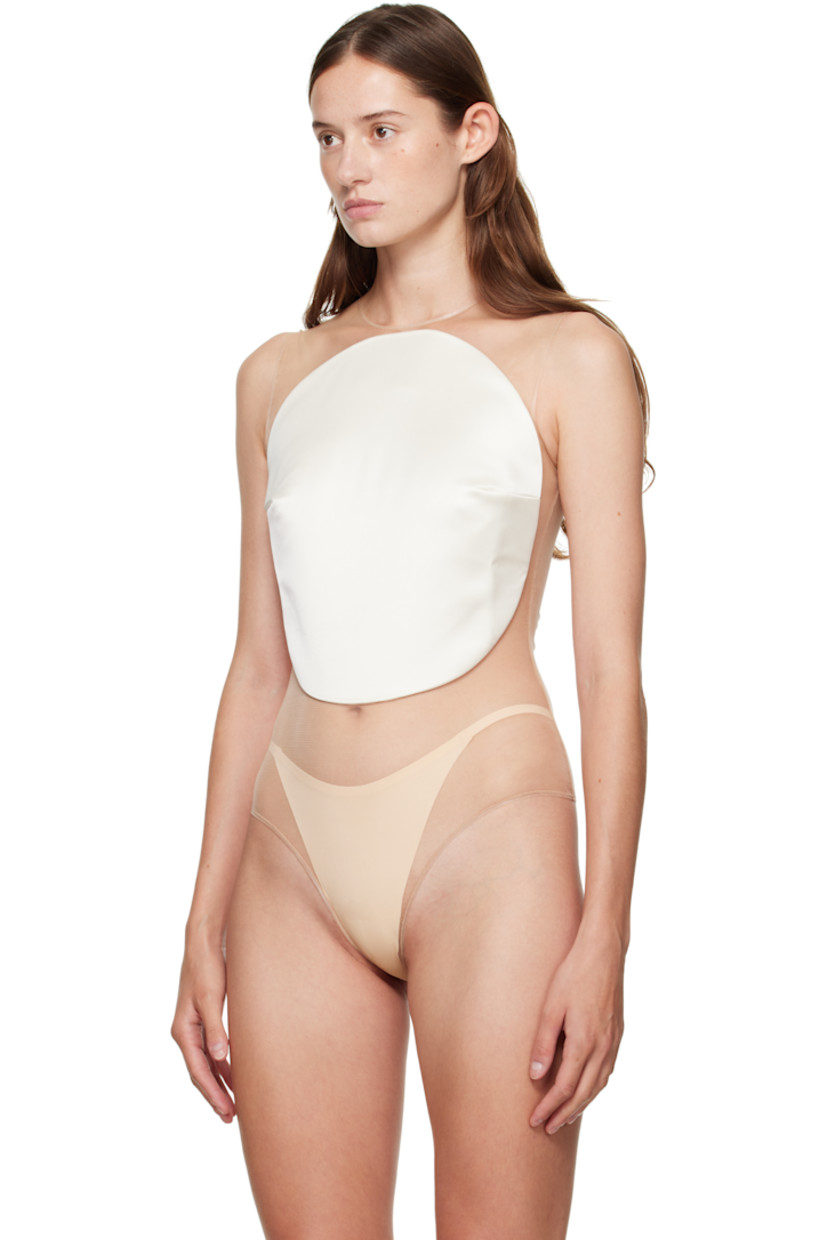 Sheer stretch tulle bodysuit.

· Scoop neck
· Satin panel with darts at chest
· Press-stud fastening at bottom

Supplier color: Ivory