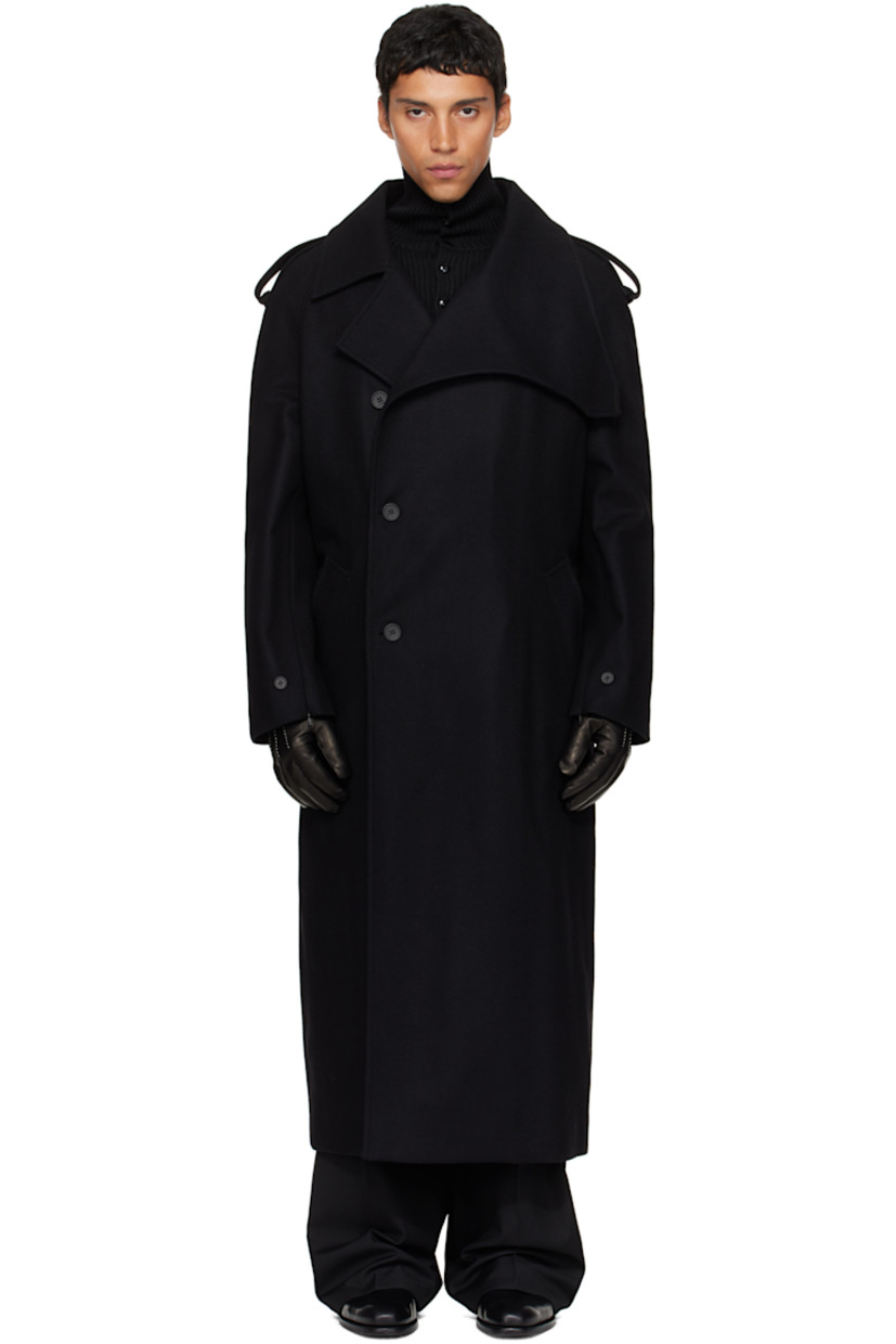 Wool-blend melton trench coat.

· Modified notched lapel
· Double-breasted button closure
· Welt pockets at waist
· Integrated button belt
· Epaulets
· Raglan sleeves
· Zip vent and button tab at cuffs
· Storm flap at back
· Central vent at back hem
· Welt pocket at interior
· Full satin lining

Supplier color: Black