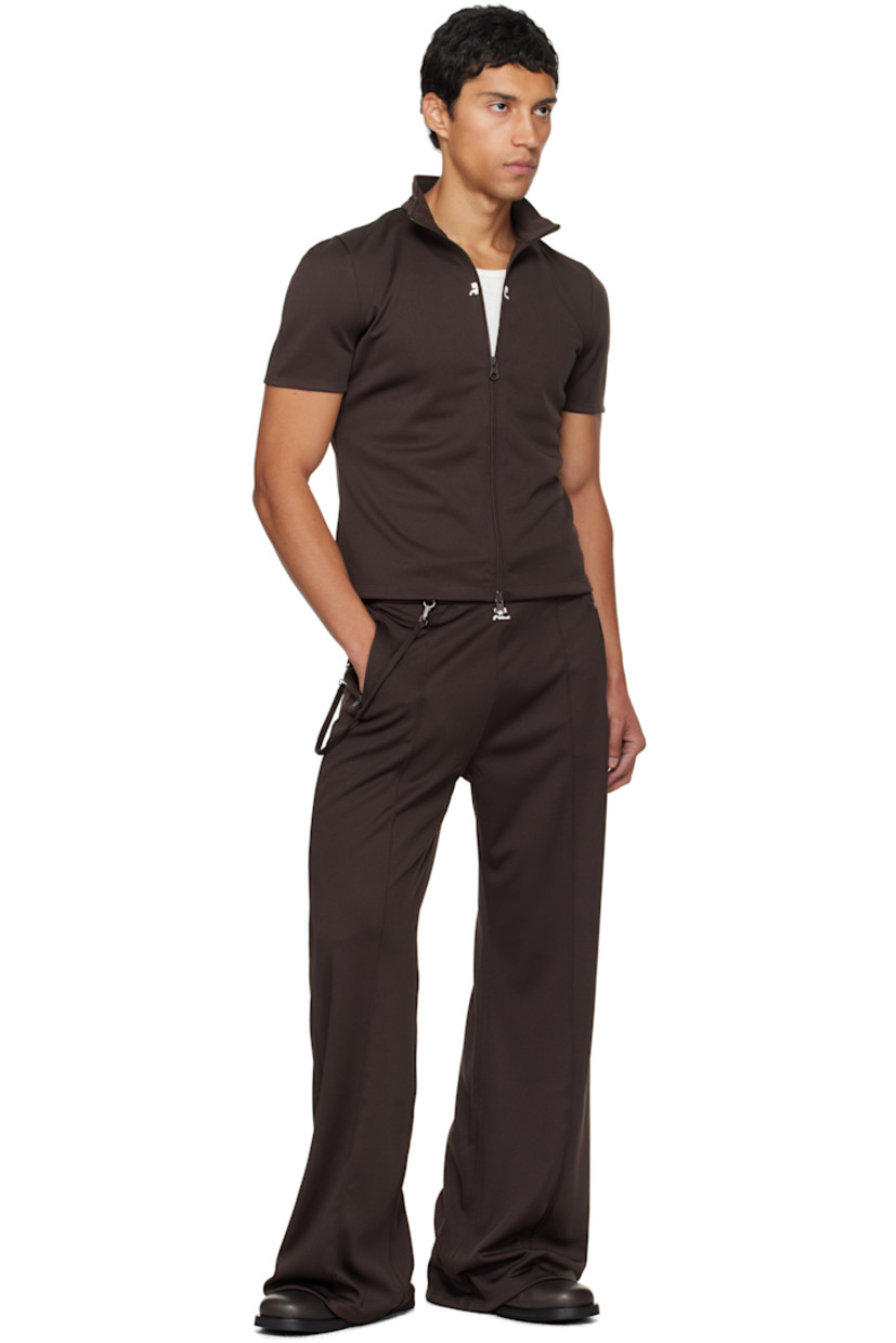 Flared interlock jersey track pants.

· Concealed drawstring at elasticized waistband
· Three-pocket styling
· Embroidered logo patch at front
· Detachable strap at front waist and back pocket
· Pinched seams at legs

Supplier color: Chocolate