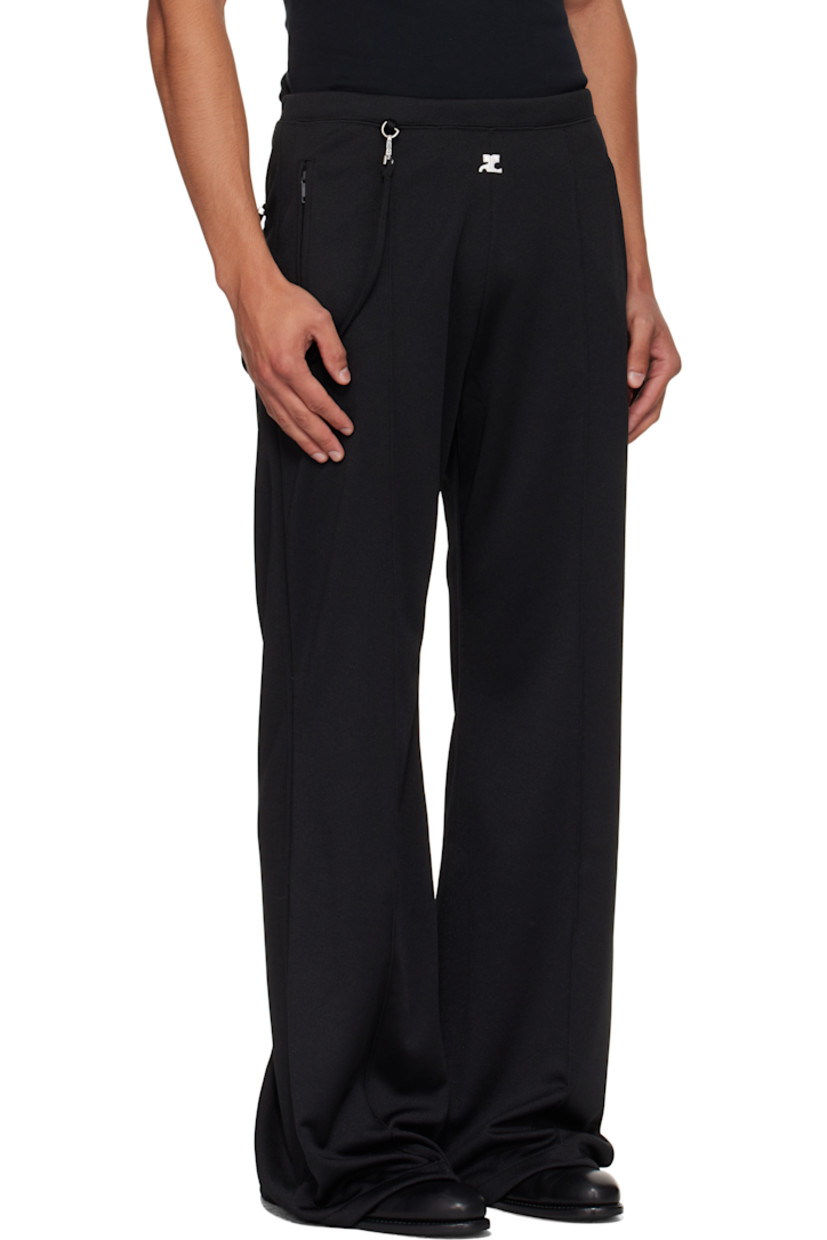 Flared interlock jersey track pants.

· Concealed drawstring at elasticized waistband
· Three-pocket styling
· Embroidered logo patch at front
· Detachable strap at front waist and back pocket
· Pinched seams at legs

Supplier color: Black