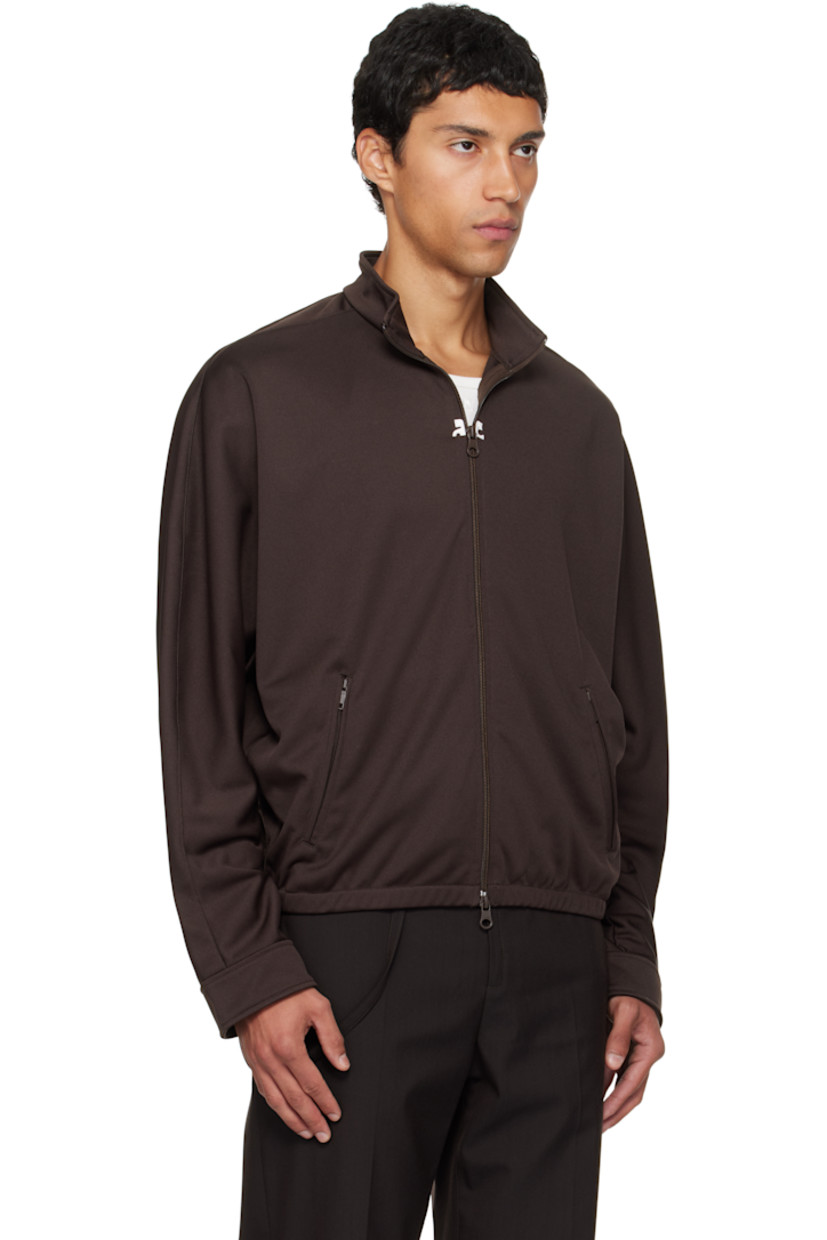 Interlock jersey track jacket.

· Stand collar
· Two-way zip closure
· Embroidered logo patches at chest
· Zip pockets at waist
· Elasticized hem
· Logo flag at side seam
· Dolman sleeves

Supplier color: Chocolate