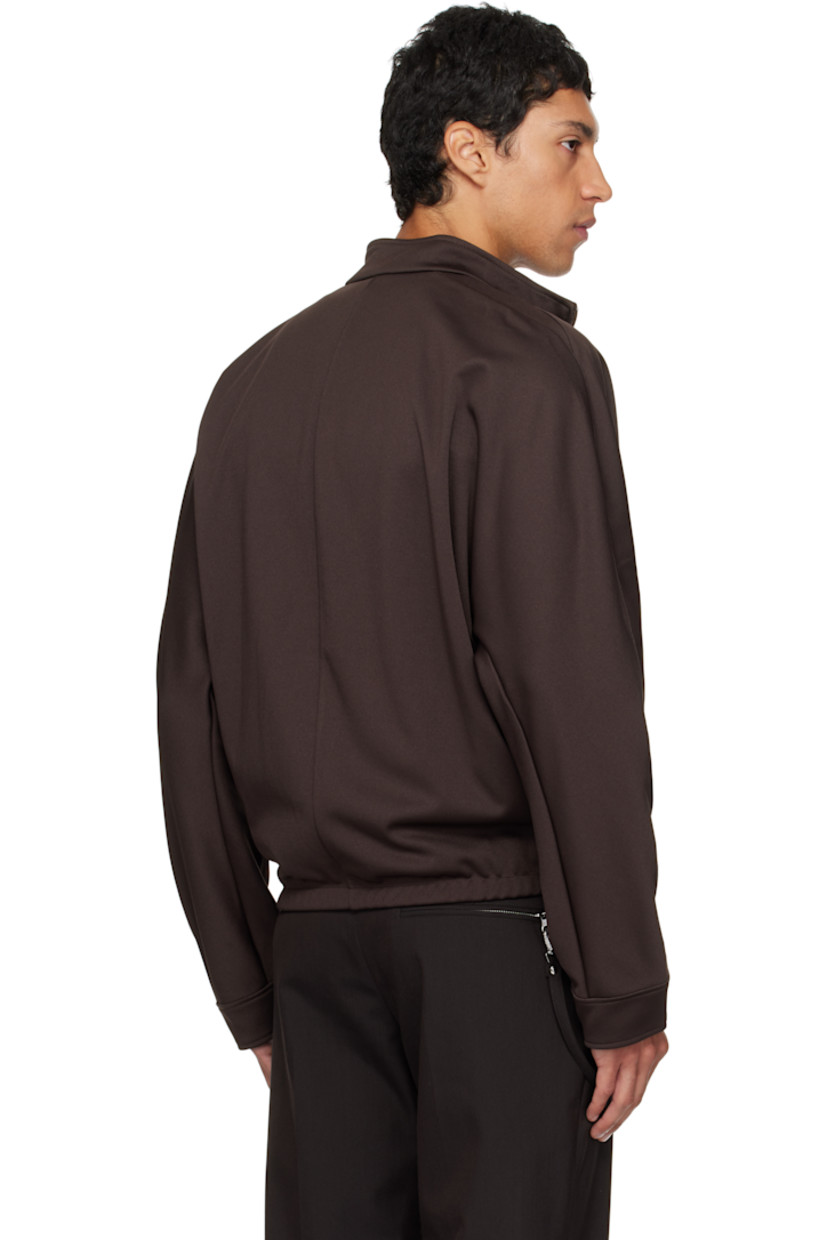 Interlock jersey track jacket.

· Stand collar
· Two-way zip closure
· Embroidered logo patches at chest
· Zip pockets at waist
· Elasticized hem
· Logo flag at side seam
· Dolman sleeves

Supplier color: Chocolate