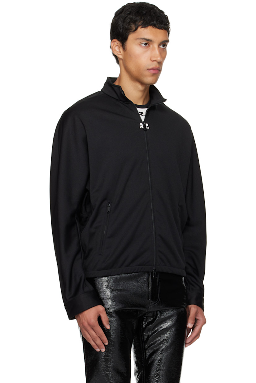 Interlock jersey track jacket.

· Stand collar
· Two-way zip closure
· Embroidered logo patches at chest
· Zip pockets at waist
· Elasticized hem
· Logo flag at side seam
· Dolman sleeves

Supplier color: Black