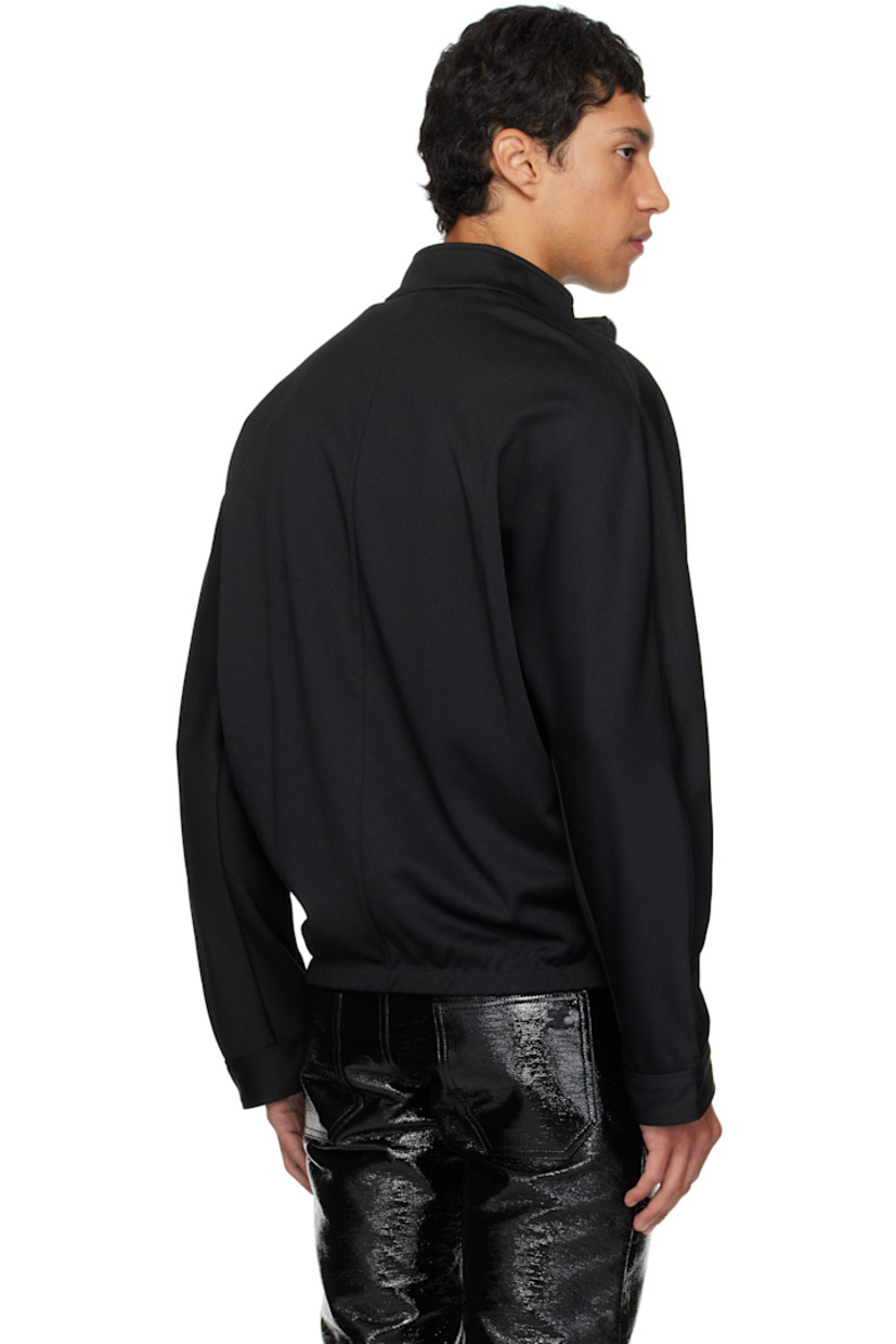 Interlock jersey track jacket.

· Stand collar
· Two-way zip closure
· Embroidered logo patches at chest
· Zip pockets at waist
· Elasticized hem
· Logo flag at side seam
· Dolman sleeves

Supplier color: Black