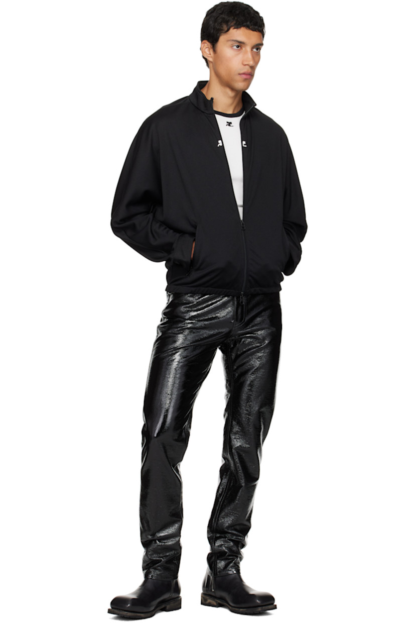 Interlock jersey track jacket.

· Stand collar
· Two-way zip closure
· Embroidered logo patches at chest
· Zip pockets at waist
· Elasticized hem
· Logo flag at side seam
· Dolman sleeves

Supplier color: Black