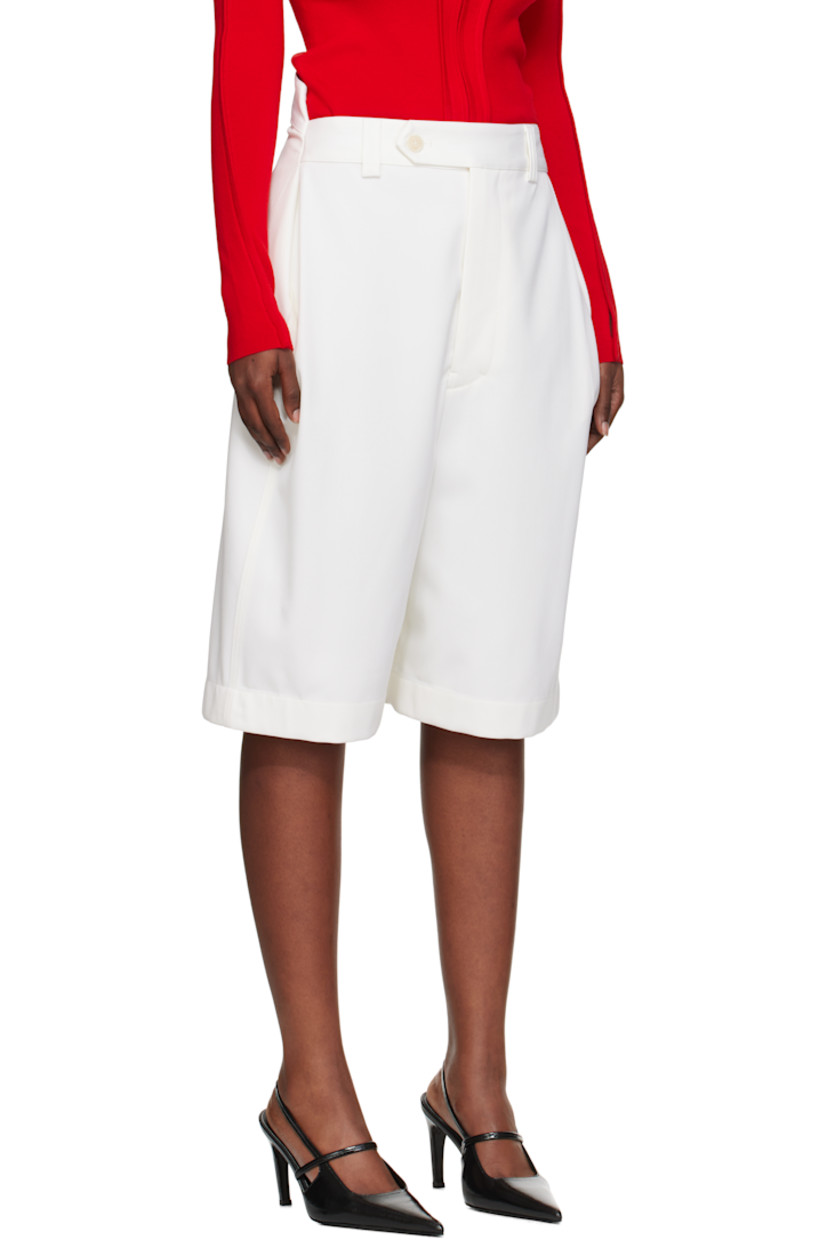Wool-blend twill shorts.

· High-rise
· Belt loops
· Two-pocket styling
· Zip fly 
· Notch at back waistband
· Adjustable button tab at back waist
· Full plain-woven cotton-blend lining 

Supplier color: Ivory