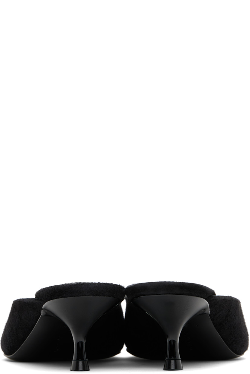 Brushed goatskin suede mules.

· Pointed square toe 
· Logo patch at padded footbed
· Leather lining
· Kitten heel with rubber injection
· Calfskin sole 
· Heel: H2"

Supplier color: Black