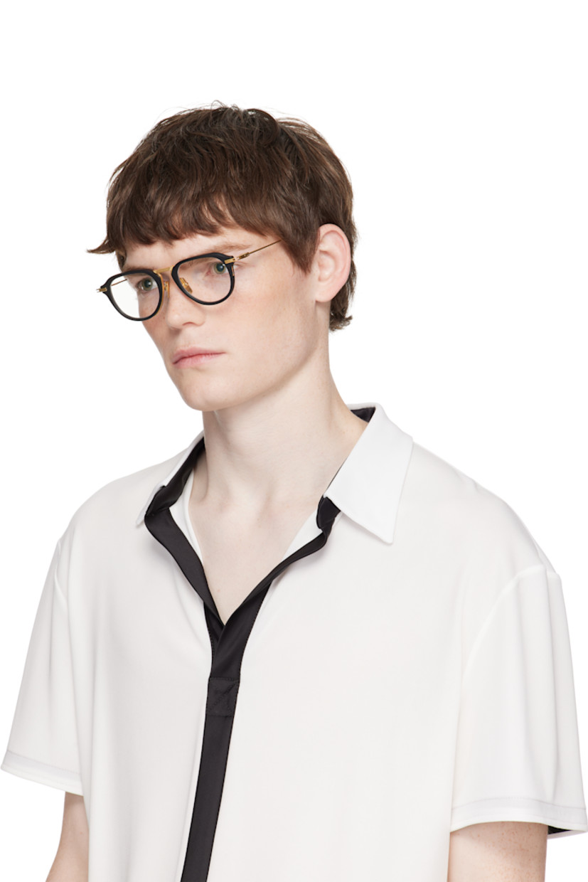 Handcrafted round titanium- and acetate-frame optical glasses.

· Adjustable titanium nose pads
· Cutout at temples 
· Inset logo at temple tip
· Includes case
· Size: 49.21 140

Supplier color: Matte black/Gold