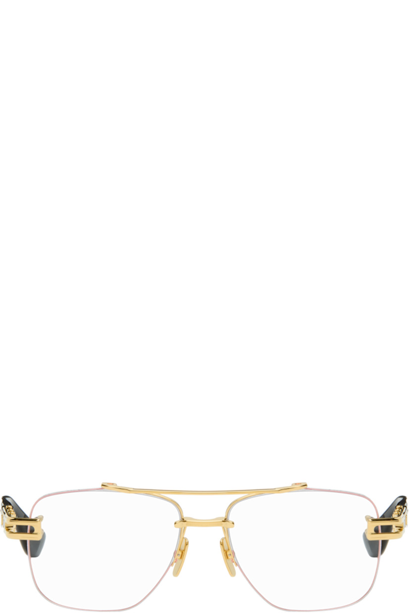 Handcrafted aviator-style titanium- and acetate-frame optical glasses.

· Adjustable titanium nose pads
· Double bridge
· Fluted detailing at temples
· Inset logo at temple tip 
· Includes case
· Size: 57.16 145

Supplier color: Yellow gold/Black