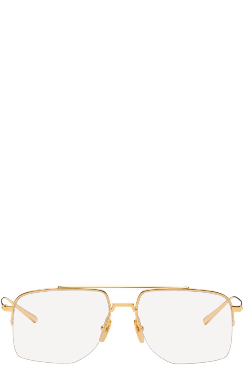 Aviator-style and semi-rimless titanium-frame optical glasses.

· Handcrafted
· Adjustable titanium nose pads
· Top bar
· Inset green enamel at temple tips
· Logo embossed at temple tip
· Includes case
· Size: 56.16 145

Supplier color: Yellow gold