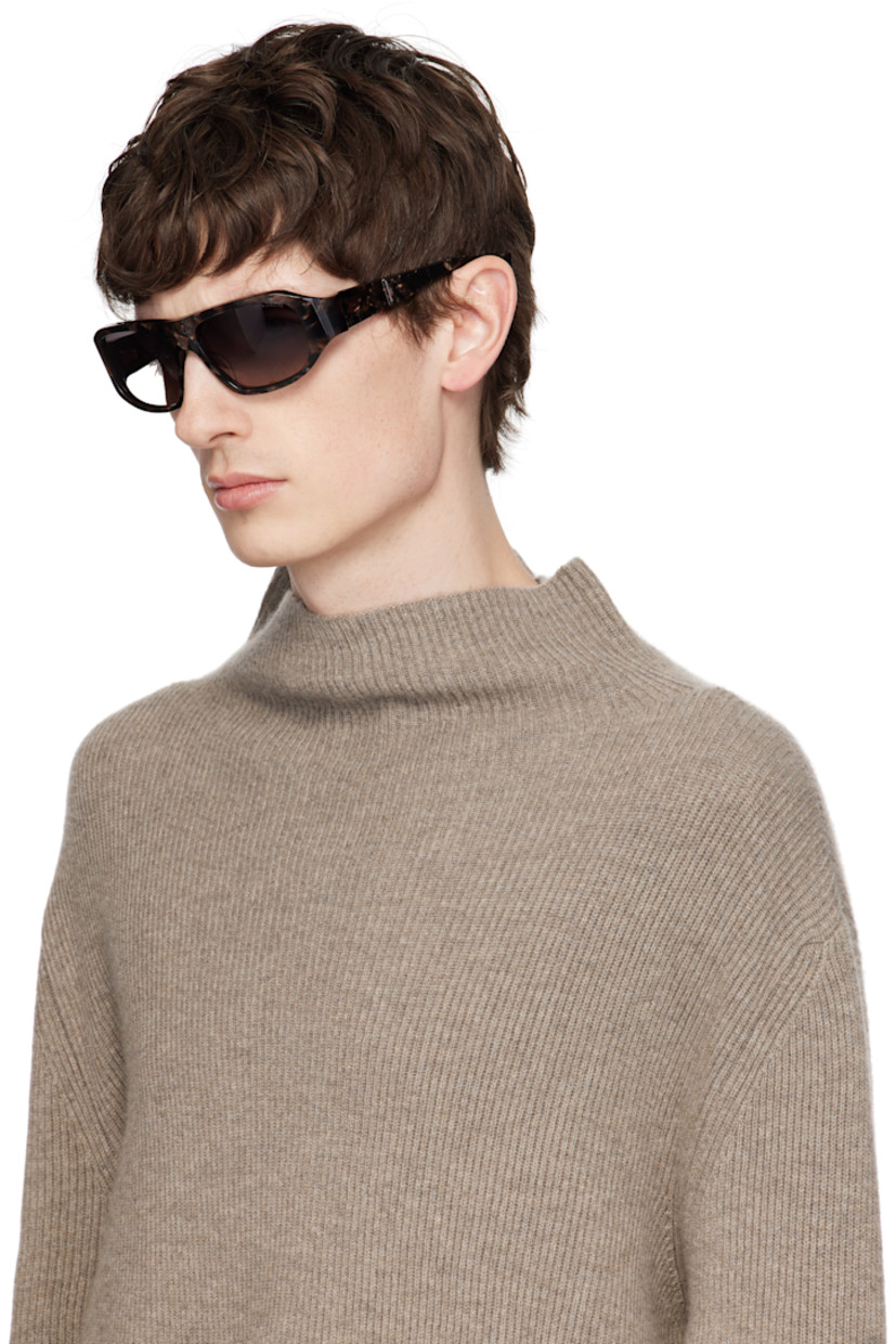 Handcrafted square tortoiseshell acetate-frame sunglasses in tones of brown.

· Anti-reflective gray lenses
· 100% UVA/UVB protection 
· Logo etched at lens
· Integrated nose pads
· Logo plaque at temples
· Inset logo hardware at temple tip
· Includes case
· Size: 56.16 123

Supplier color: Desert abalone/Champagne