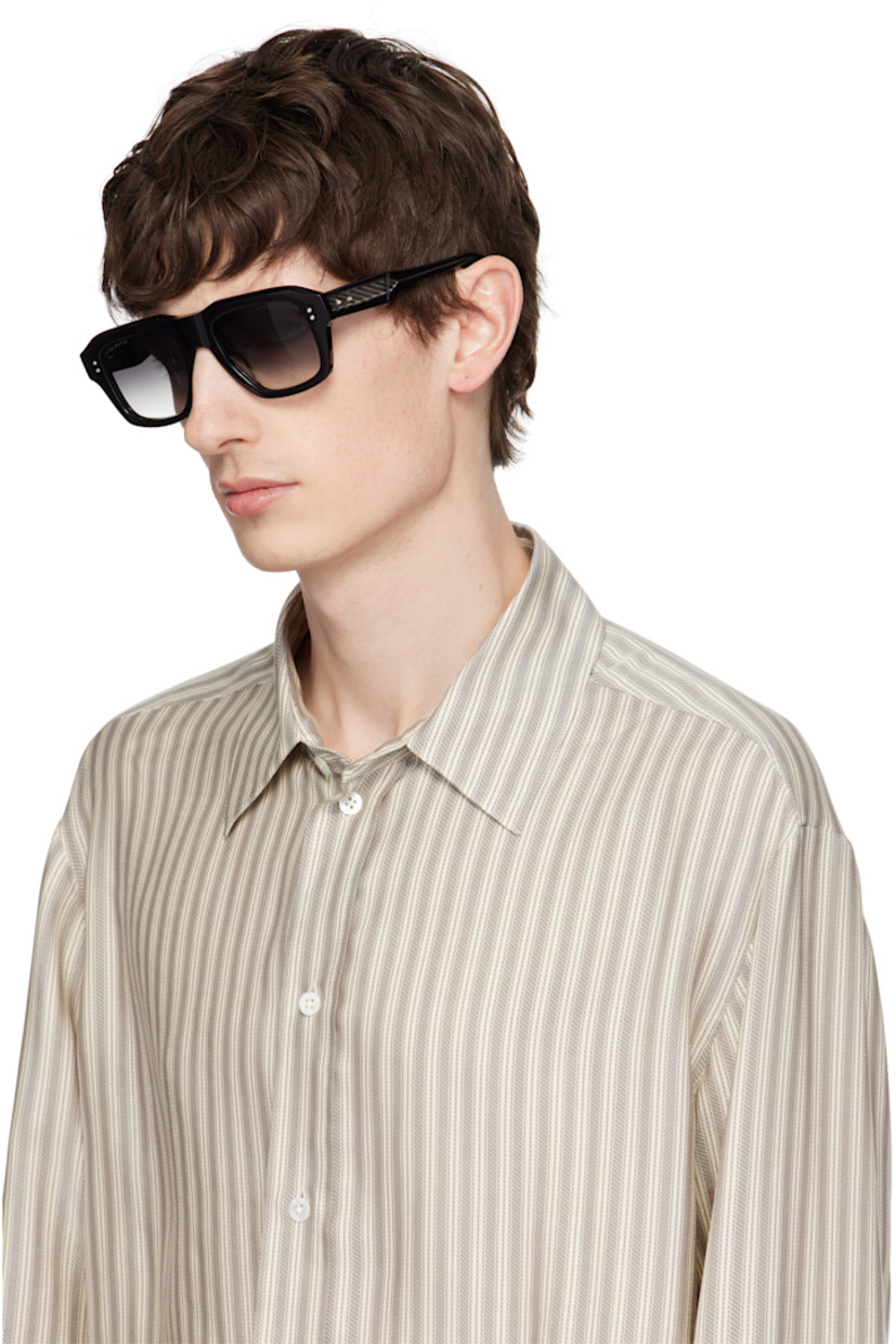 Handcrafted square acetate-frame sunglasses in black.

· Anti-reflective gray lenses
· 100% UVA/UVB protection
· Logo and text etched at lenses
· Integrated nose pads
· Exposed core wires
· Inset logo hardware at temple tip
· Silver-tone hardware 
· Includes case 
· Size: 53.21 150

This item is part of a limited run of 450.

Supplier color: Black