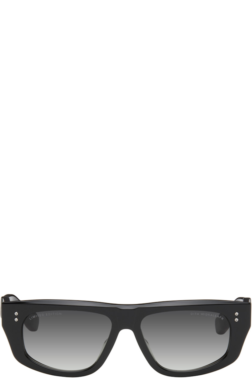 Handcrafted cat-eye acetate-frame sunglasses in black.

· Anti-reflective gray lenses
· 100% UVA/UVB protection 
· Logo and text etched at lenses
· Integrated nose pads
· Exposed core wires
· Inset logo hardware at temple tip
· Silver- and gold-tone hardware
· Includes case
· Size: 56.16 130

This item is part of a limited run of 250.

Supplier color: Black
