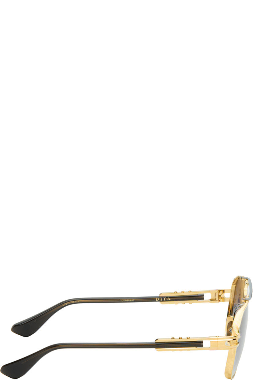 Handcrafted aviator-style titanium-frame sunglasses.

· Anti-reflective CR-39 gray lenses
· Logo etched at lens
· 100% UVA/UVB protection
· Adjustable titanium nose pads
· Double bridge
· Fluted detailing at black acetate temples
· Inset logo at temple tip
· Includes case
· Size: 61.14 145-155

Supplier color: Yellow gold/Antique silver
