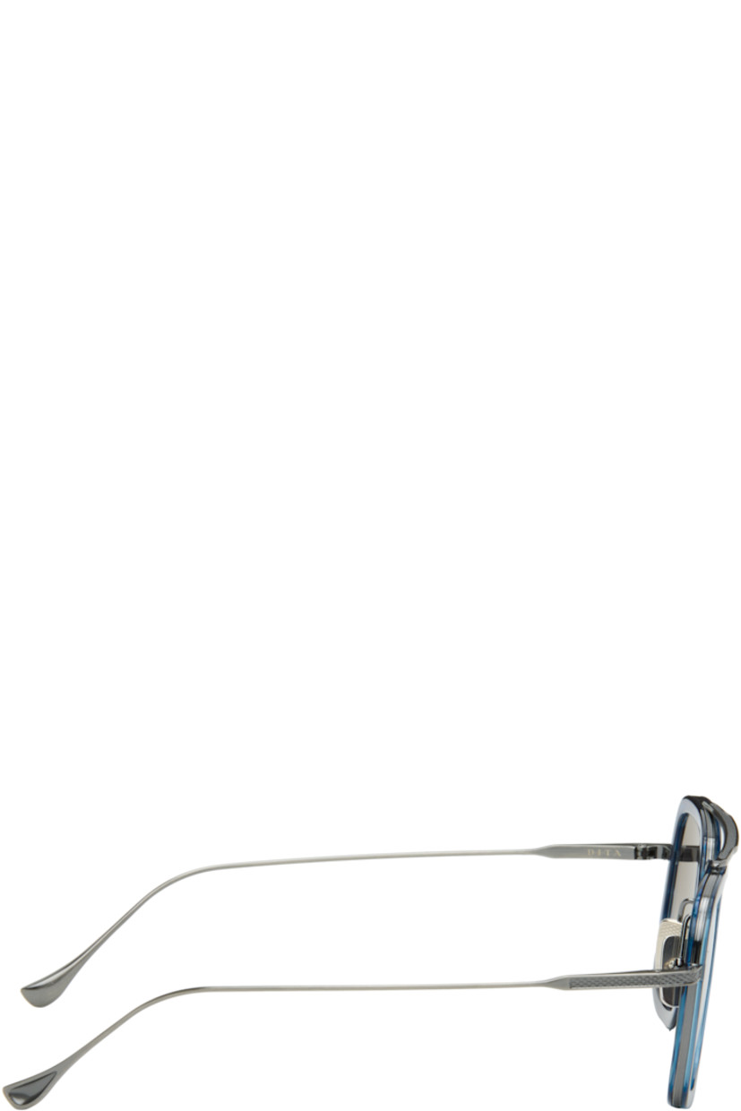 Handcrafted aviator-style titanium- and acetate-frame sunglasses.

· Anti-reflective CR-39 mirrored gray lenses
· Logo etched at lens
· 100% UVA/UVB protection
· Adjustable metal nose pads
· Double bridge
· Includes case
· Size: 52.22 144

Supplier color: Blue swirl/Antique silver