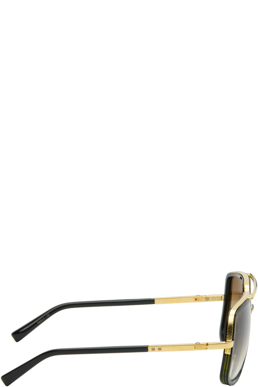 Handcrafted aviator-style titanium- and acetate-frame sunglasses.

· Anti-reflective CR-39 brown lenses
· Logo etched at lens
· 100% UVA/UVB protection
· Top bar
· Adjustable titanium nose pads
· Includes case
· Size: 59.17 127

Supplier color: Black/Yellow gold