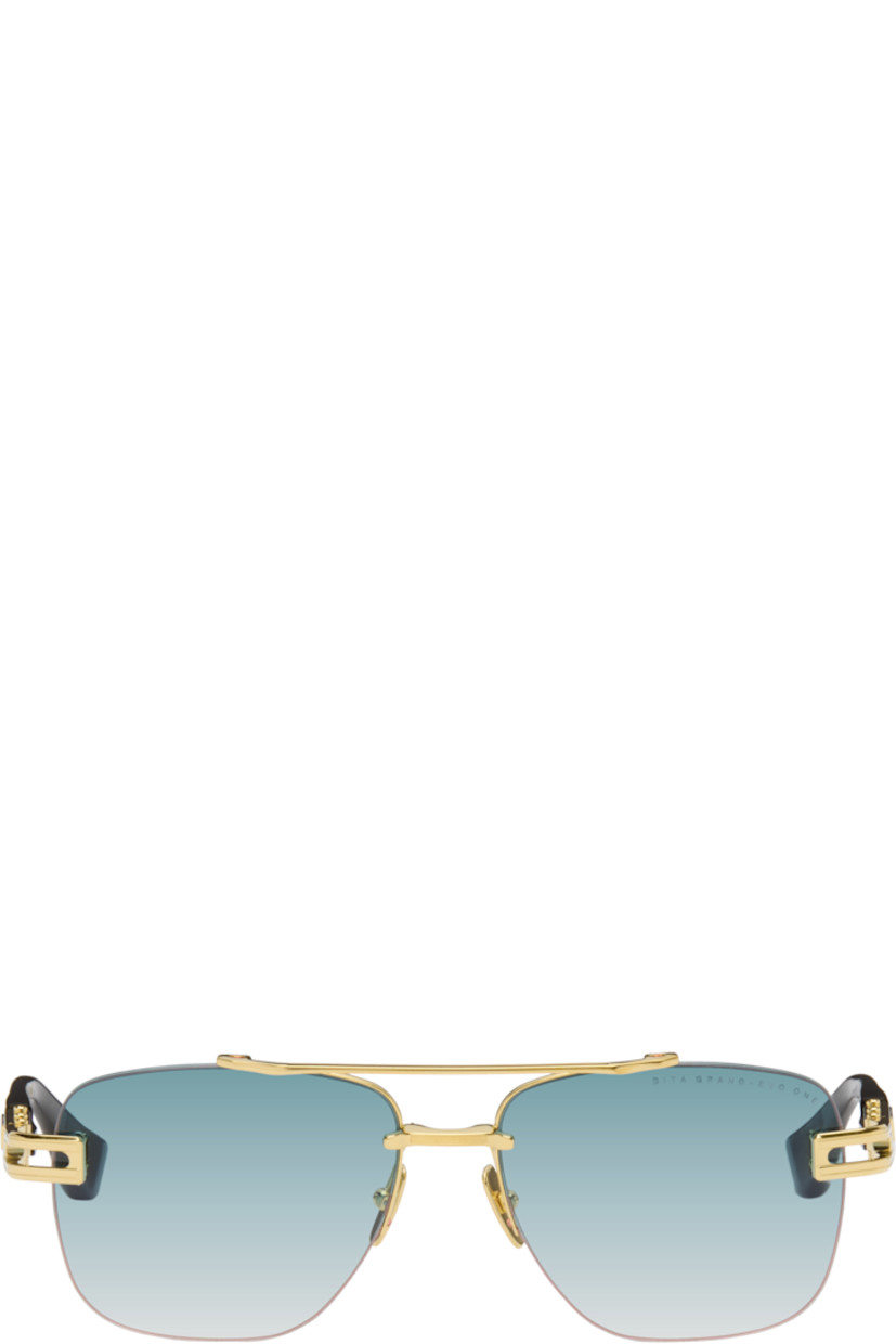 Handcrafted and aviator-style rimless titanium- and acetate-frame sunglasses. 

· Anti-reflective CR-39 blue lenses
· Logo etched at lens 
· 100% UVA/UVB protection
· Top bar 
· Adjustable metal nose pads
· Fluted detailing at temples
· Inset logo at temple tip
· Includes case
· Size: 57.16 145

Available exclusively at SSENSE.

Supplier color: Black/Gold