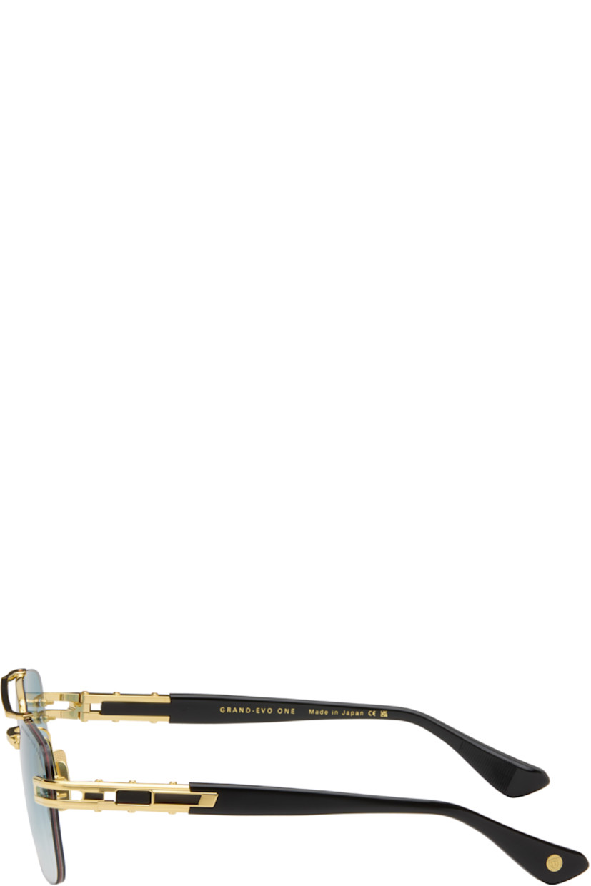 Handcrafted and aviator-style rimless titanium- and acetate-frame sunglasses. 

· Anti-reflective CR-39 blue lenses
· Logo etched at lens 
· 100% UVA/UVB protection
· Top bar 
· Adjustable metal nose pads
· Fluted detailing at temples
· Inset logo at temple tip
· Includes case
· Size: 57.16 145

Available exclusively at SSENSE.

Supplier color: Black/Gold